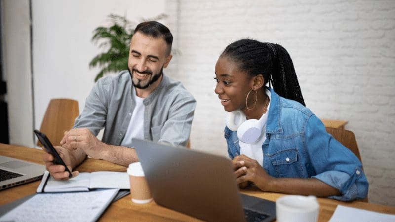 Image of two people talking about the top 5 HOA Management Companies in Houston, TX. 