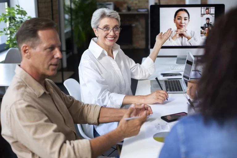 people using digital device while in a HOA executive session